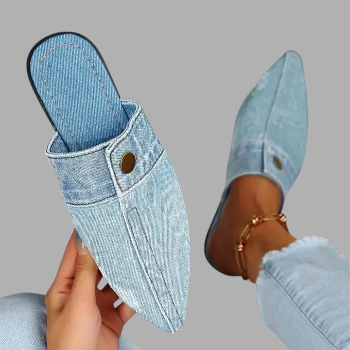 Black women's flat mule sandals, versatile and comfortable slip-on shoes for casual summer style.