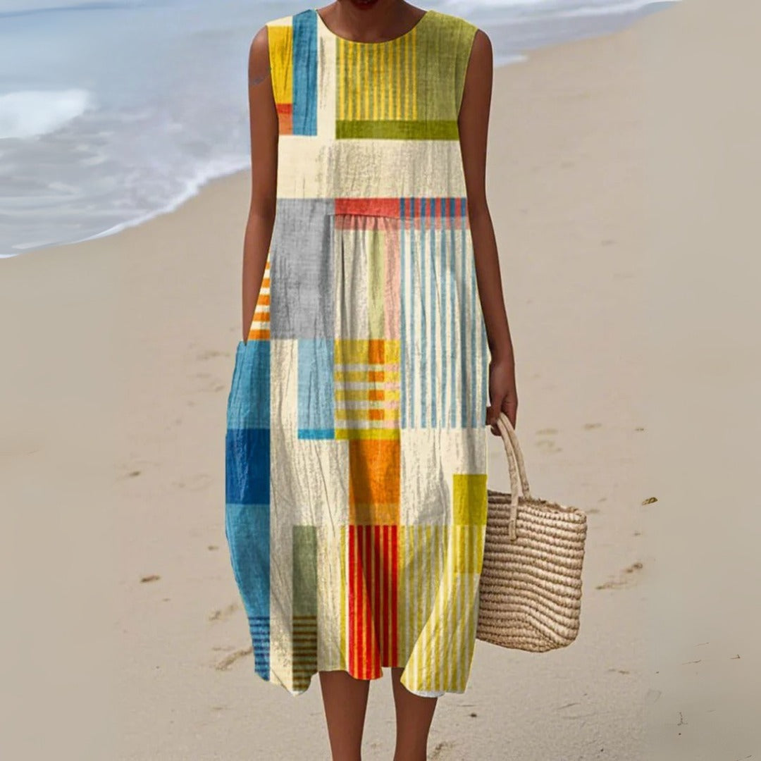 Women's casual striped patchwork midi dress with a relaxed fit, sleeveless design, and pockets. Perfect for summer.