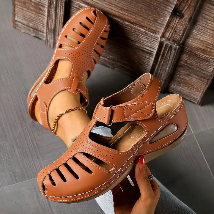 Women's stylish slip-on sandals, comfortable open-toe flats for casual everyday wear. Modern summer footwear fashion.