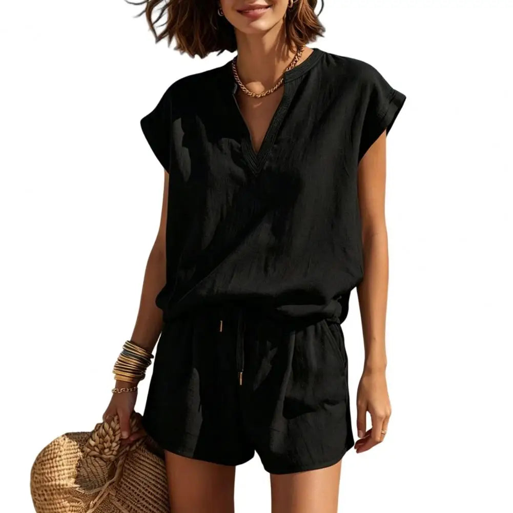 Stylish women's summer co-ord set: notch V-neck, cap sleeve top & comfortable shorts, casual wear.