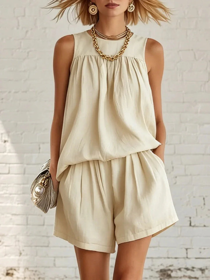 Women's casual two-piece shorts set with gathered sleeveless top & high-waist shorts for summer wear.