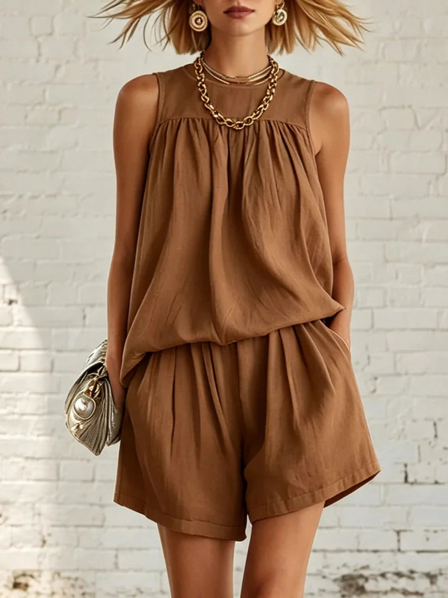 Women's comfortable two-piece shorts set. Gathered sleeveless top & high-waist shorts for casual summer fashion.