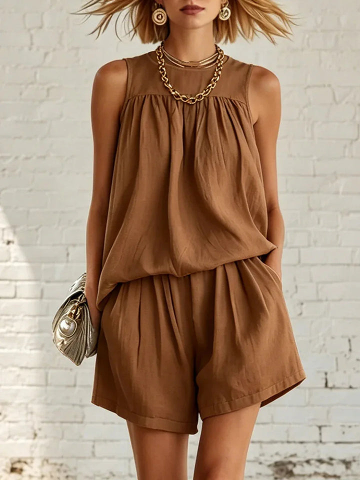 Women's comfortable two-piece shorts set. Gathered sleeveless top & high-waist shorts for casual summer fashion.
