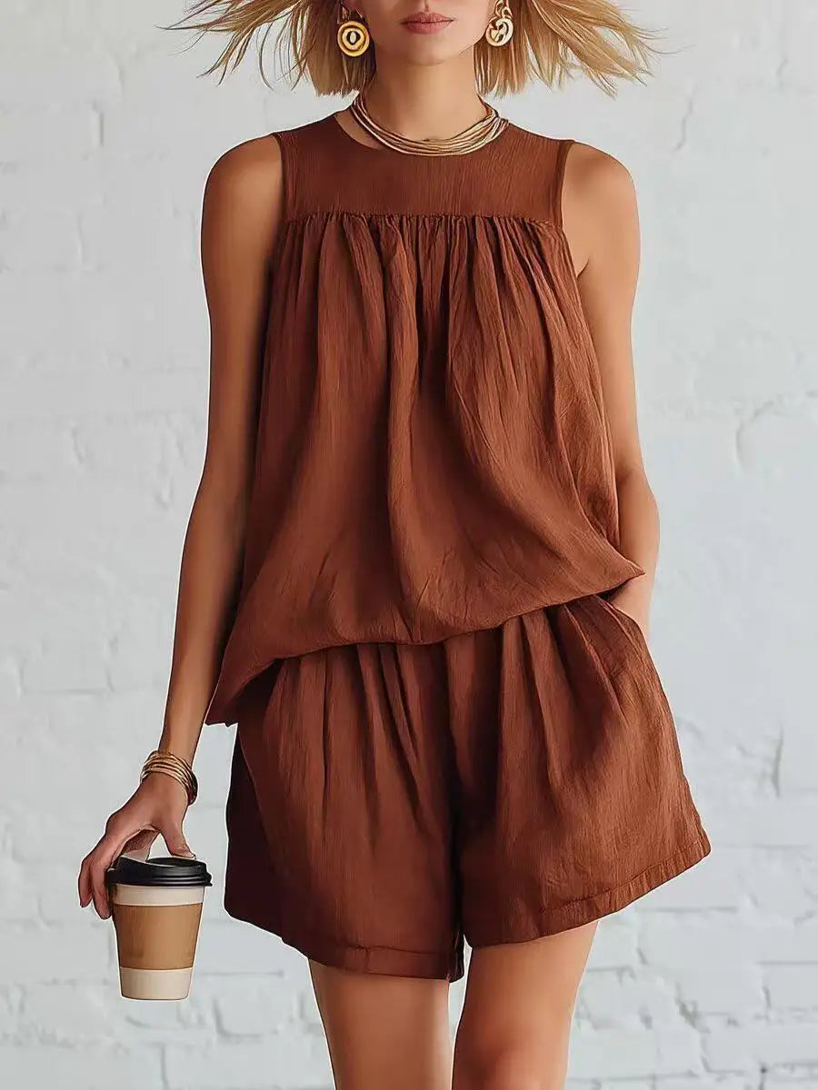 Relaxed fit women's casual outfit: sleeveless gathered top & high-waist shorts two-piece set for summer style.