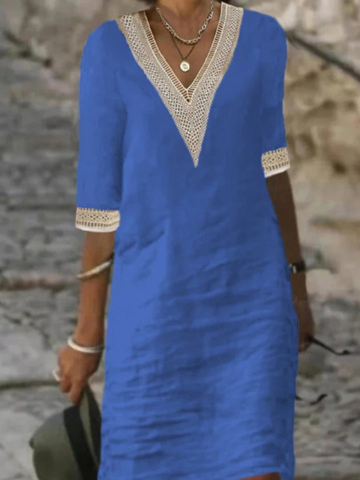 Relaxed fit knee-length V-neck dress for women, featuring elegant lace trim & comfortable 3/4 sleeves.