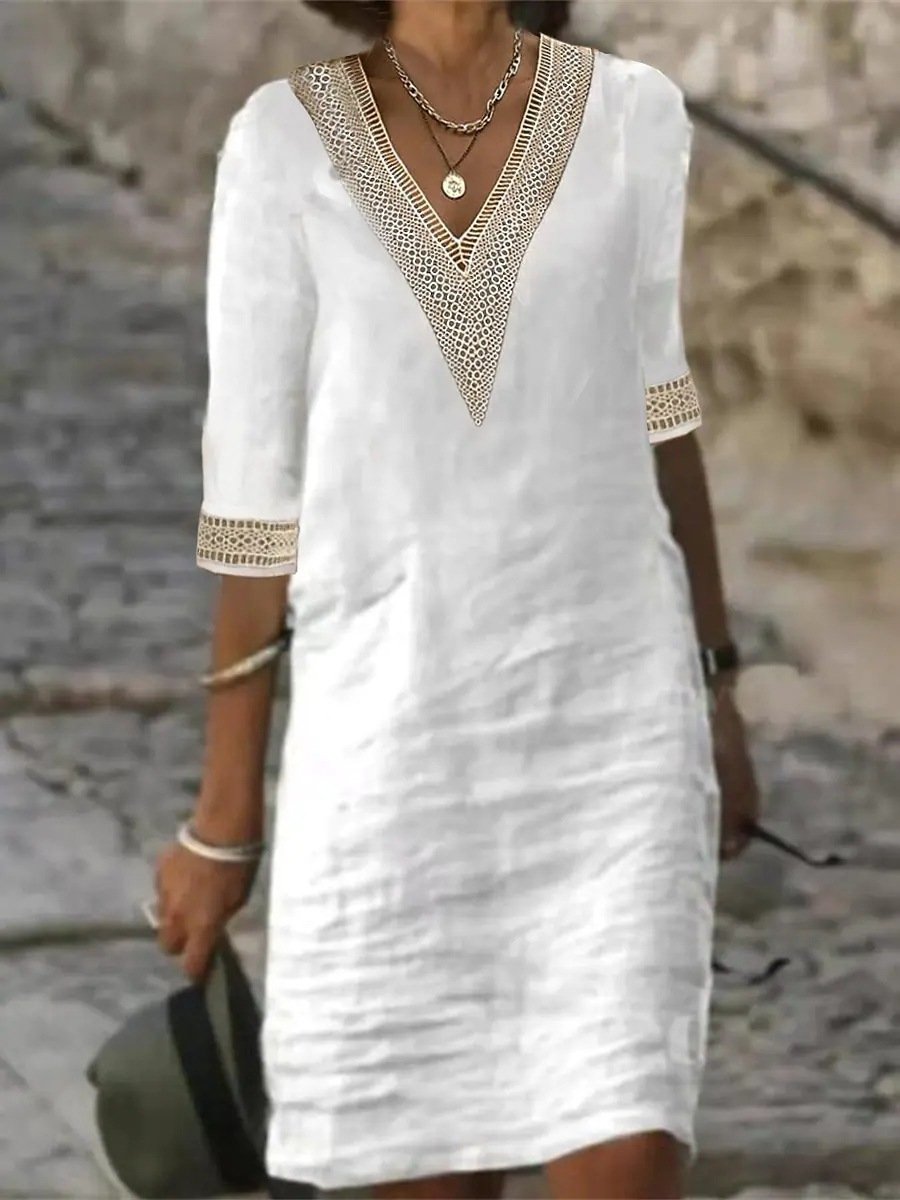 Stylish women's V-neck dress, knee-length with delicate lace trim & 3/4 sleeves for casual spring outfits.