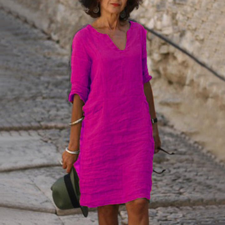 Comfortable women's midi dress with V-neck, suitable for daily wear. Versatile and relaxed fit.