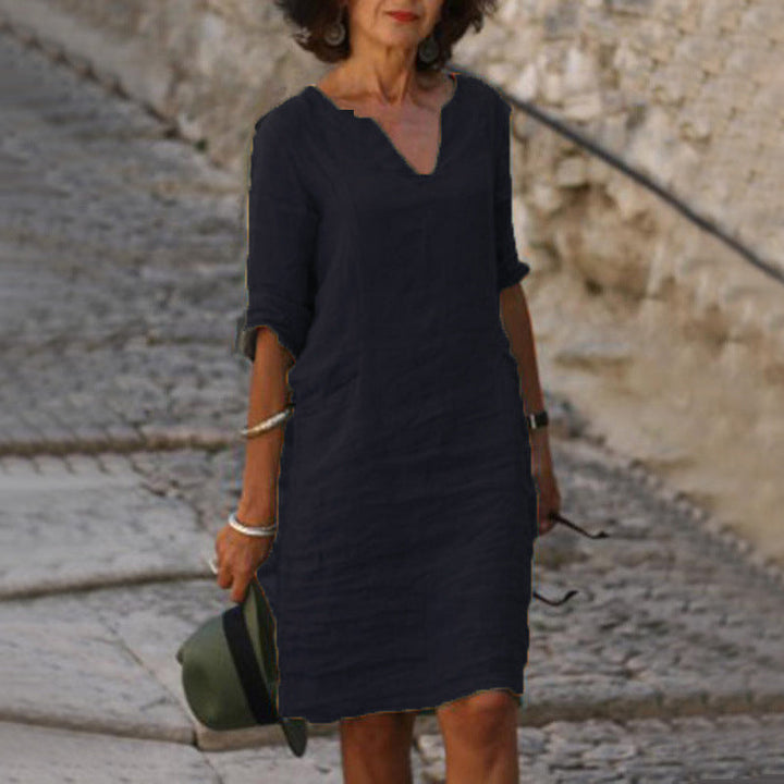 Stylish women's V-neck midi dress, a relaxed fit summer essential. Perfect for warm weather.