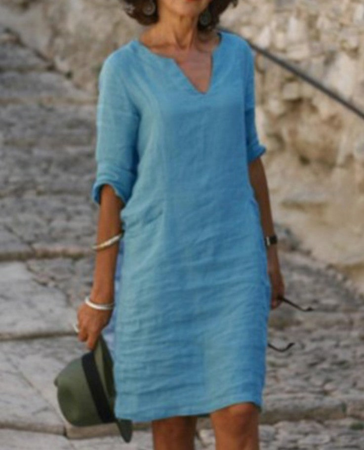 Versatile casual V-neck midi dress for women, great for beach days or relaxed outings. Effortless fashion.