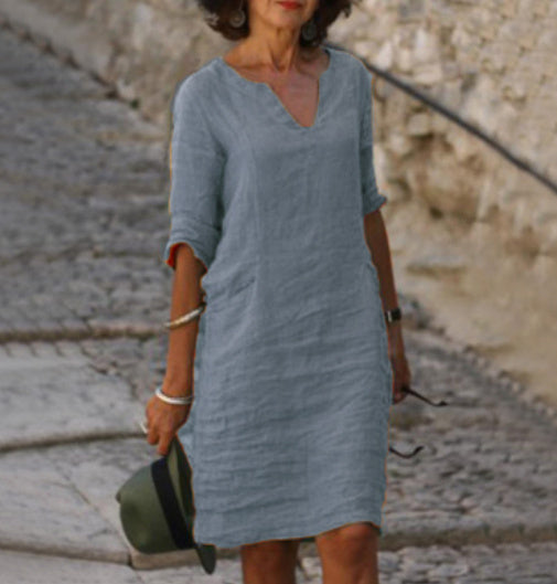 Women's plus size V-neck midi dress, offering comfortable, flattering fit. Ideal for any body type.