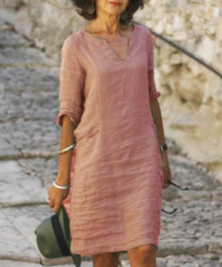 Chic V-neck midi dress for women, 3/4 sleeves, ideal for casual spring & summer looks. Comfortable design.