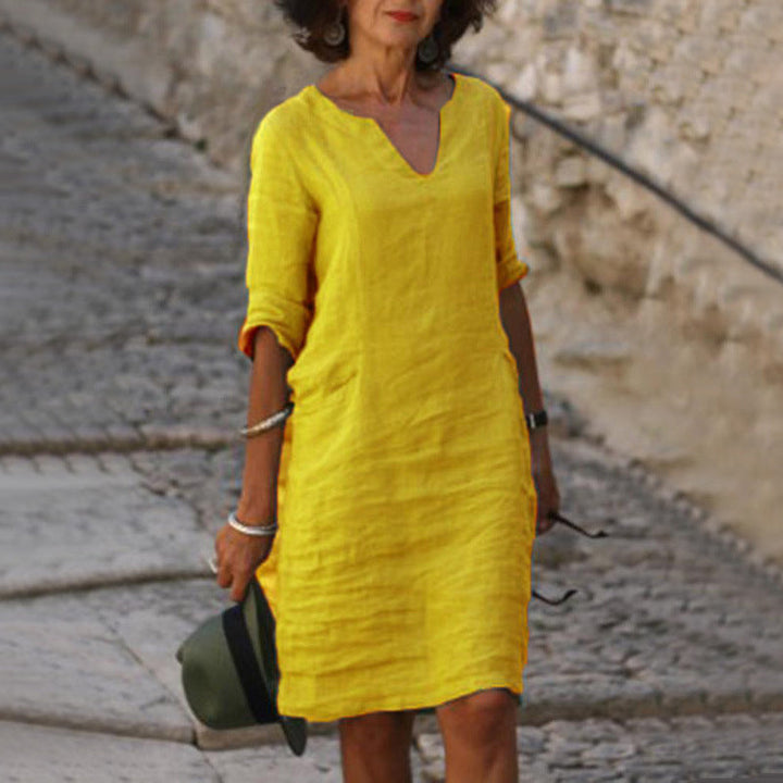 Fashionable women's casual midi dress, V-neck design, perfect for effortless vacation or summer styling.