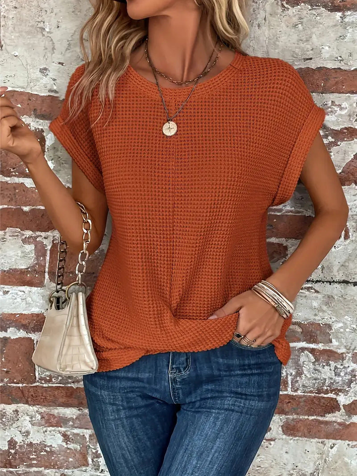 Versatile women's short sleeve waffle knit top, perfect for spring, summer, or autumn layering.