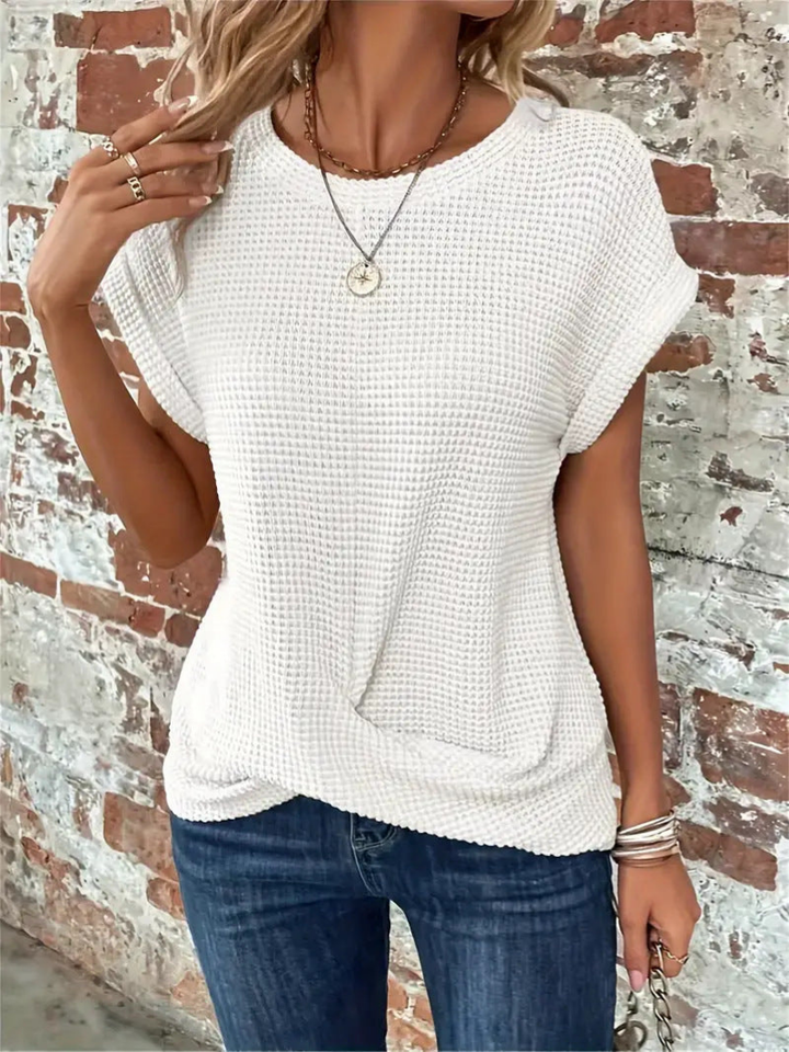 Lightweight women's short sleeve waffle knit top, ideal for casual spring & summer days. Breathable & chic.