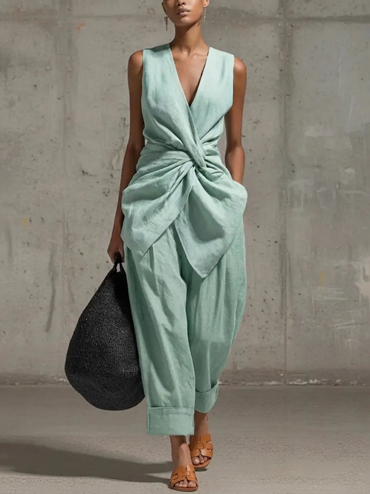 Women's casual wide leg trouser set with a stylish waist tie. Comfortable two-piece ensemble for spring & summer.