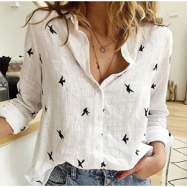 Relaxed fit women's blouse with charming bird print. Button-up front & long sleeves, ideal for casual summer style.