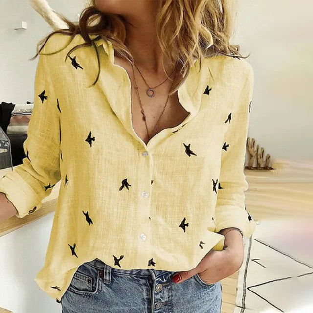Elegant women's bird print button-up blouse. Long sleeve, collared, and relaxed fit for stylish spring and summer wear.
