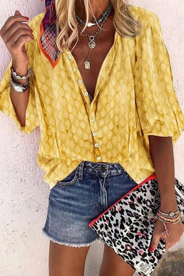 Elegant women's button-front blouse with a flowy, airy design. Perfect for chic casual or office looks.