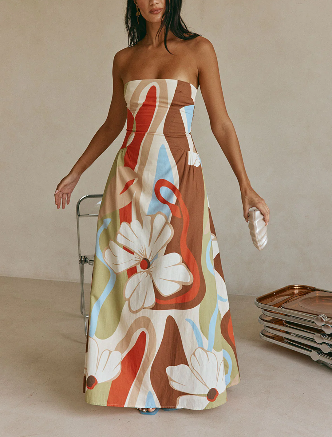 Women's chic beige floral strapless maxi dress. Elegant A-line summer style, perfect for resort wear & vacations.