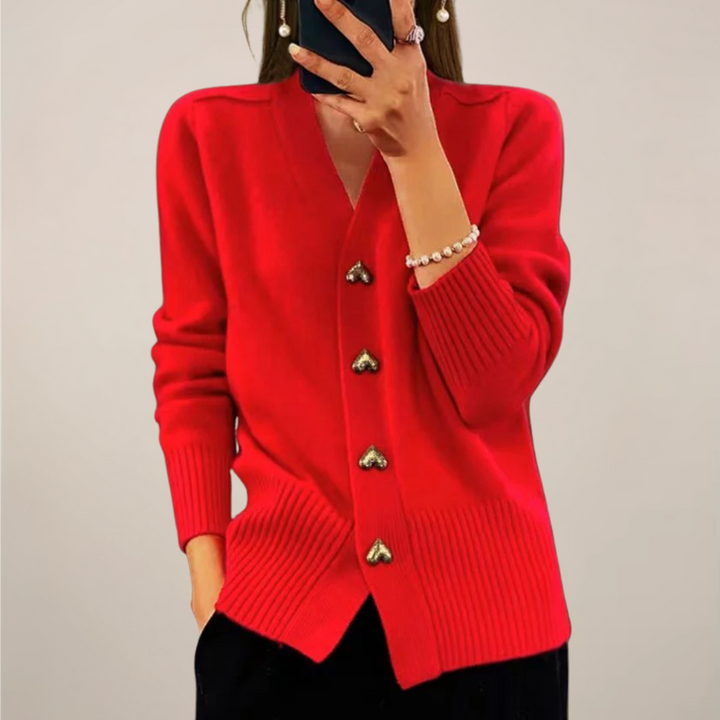 Soft knit women's cardigan sweater with charming gold heart buttons. Chic long sleeve top for various occasions.