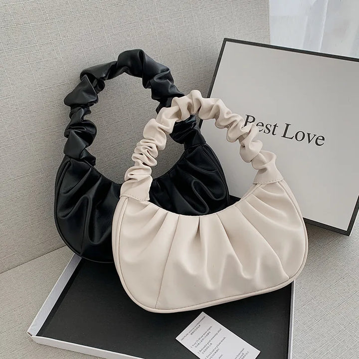 Close-up of the pleated detail on a Women's Cloud Shoulder Bag, luxury PU leather finish