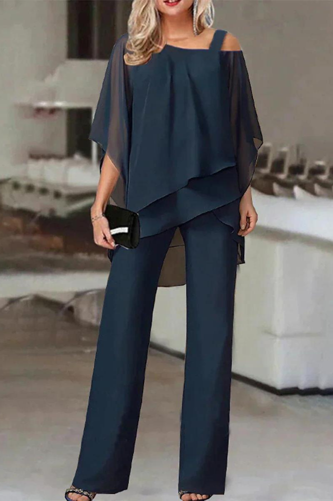 Women's chic comfortable blouse and pants matching set. Perfect two-piece outfit for relaxed everyday fashion.
