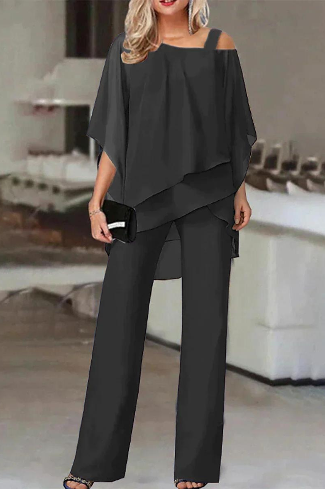 Stylish women's coordinated blouse & pants set. Versatile two-piece outfit for office wear or casual comfort.