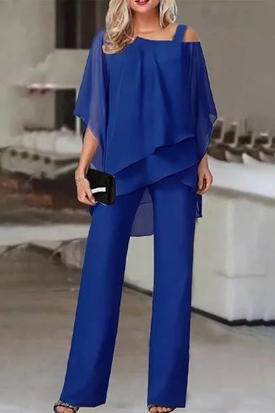Chic women's relaxed fit blouse and pants set. Comfortable two-piece outfit for stylish casual & office wear.
