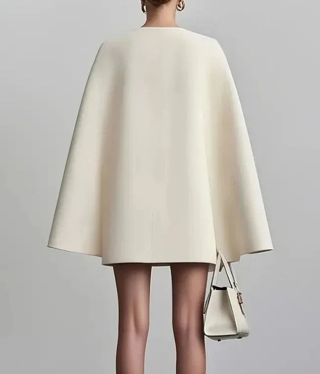 Sophisticated women's double-breasted mini dress with cape sleeves, ideal for evening events & formal wear.