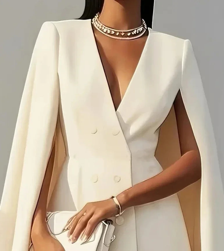 Tailored women's mini dress featuring a double-breasted design & unique cape sleeves; a chic party statement.