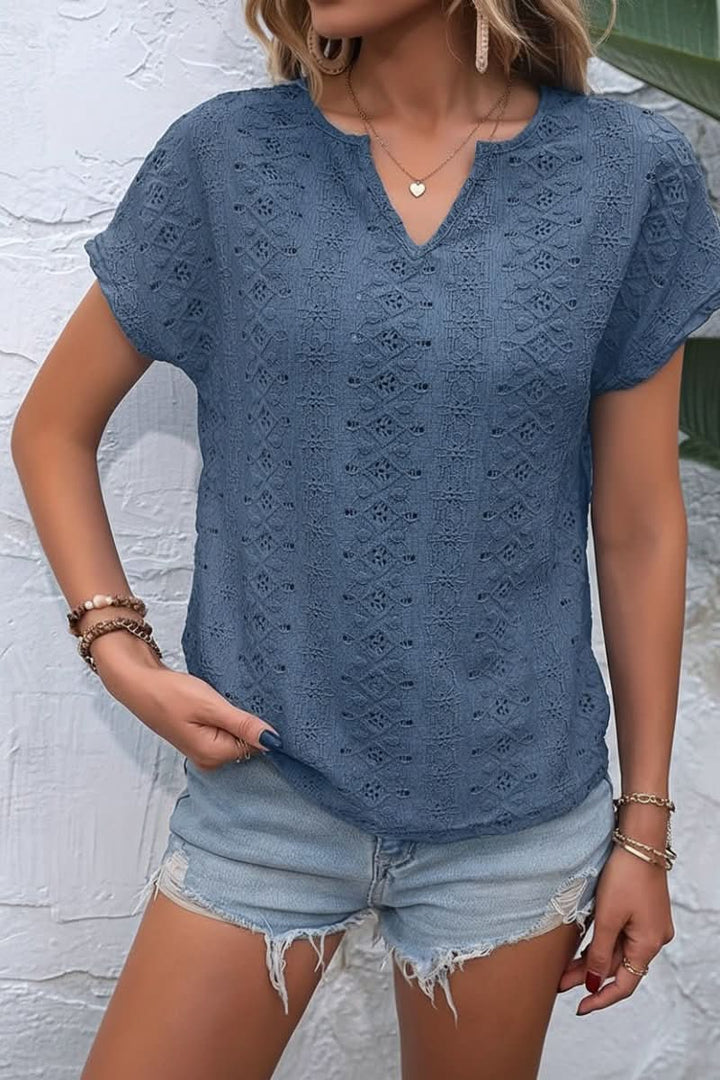 Embroidered eyelet women's t-shirt featuring a stylish notched neckline. Ideal for spring & summer.