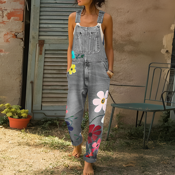 Casual women's floral denim jumpsuit, boho chic style. Ideal for spring, summer, or vacation wear. Light wash comfort.
