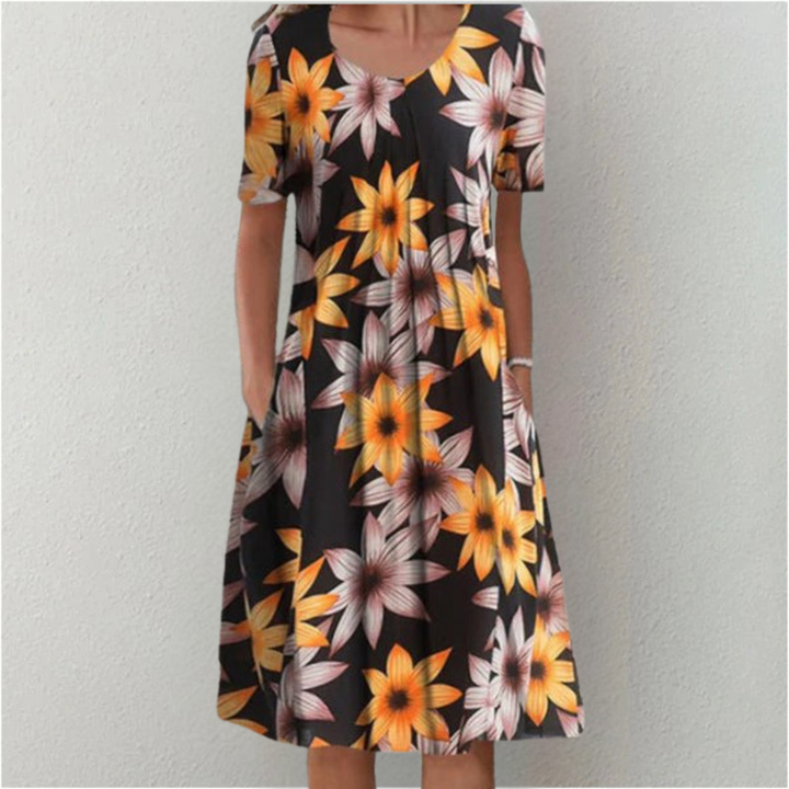 Stylish women's floral midi with short sleeves and a round neck. Perfect as a casual summer dress.