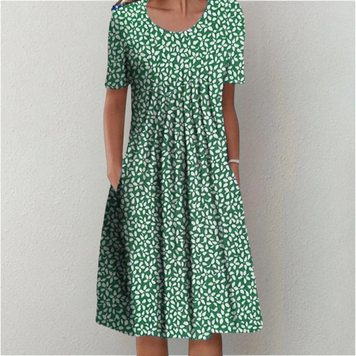 Vibrant floral print midi dress for women. Comfortable short sleeve design, perfect for a chic look.