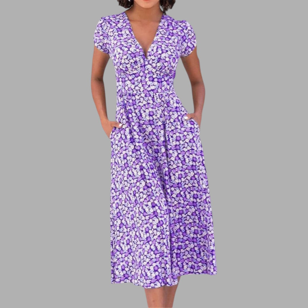 Chic women's spring floral midi dress featuring a flattering V-neck, short sleeves, and essential side pockets.