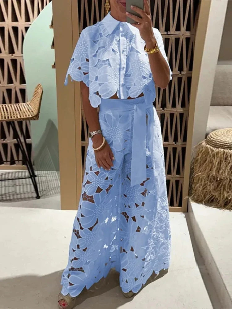 Coordinated floral two-piece summer outfit for women. Short sleeve top & high-waisted wide-leg pants.