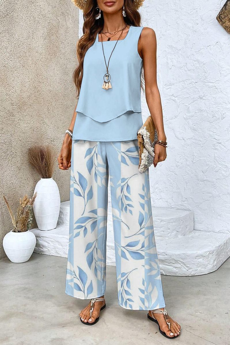 Women's chic floral two-piece set with elegant top & matching trousers, perfect for spring and summer fashion.