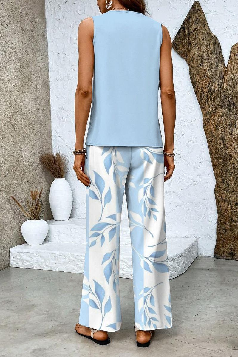 Stylish women's floral matching outfit, a versatile two-piece set featuring a chic top and comfortable trousers.