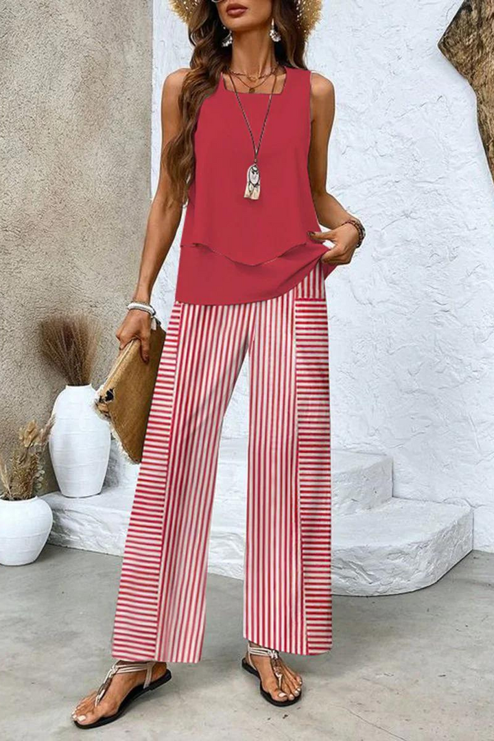 Elegant women's floral top & trouser ensemble, a comfortable two-piece set for sophisticated summer fashion.