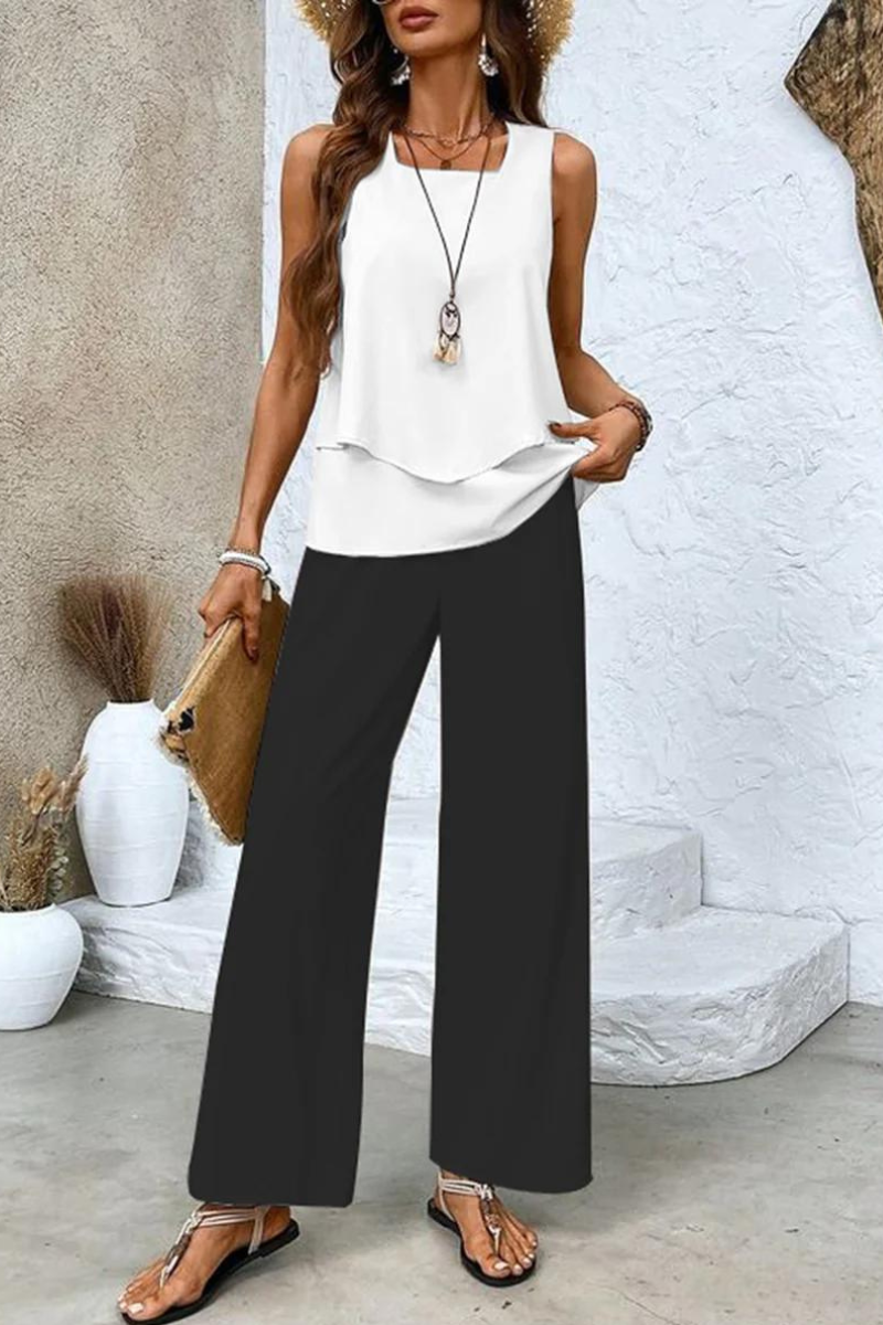 Effortlessly elegant women's floral two-piece set, a chic top & trouser combination perfect for warm weather.