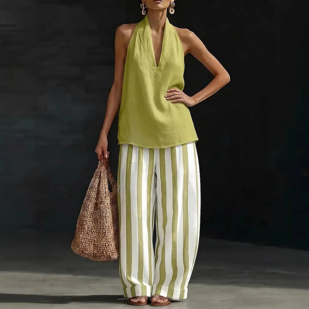 Stylish women's two-piece halter top and flowing wide leg pants set, ideal for resort wear & vacation.