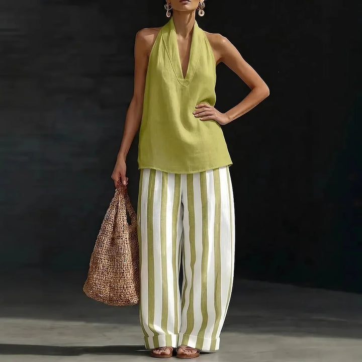 Stylish women's two-piece halter top and flowing wide leg pants set, ideal for resort wear & vacation.