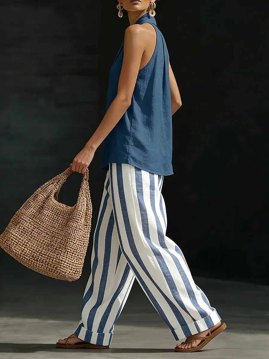 Casual women's outfit: high waist wide leg pants paired with a flattering halter top for summer style.