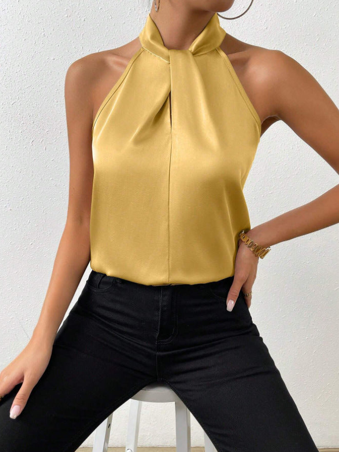 Dressy women's top, sleeveless halter with knot neck, offering chic style and versatile wear.