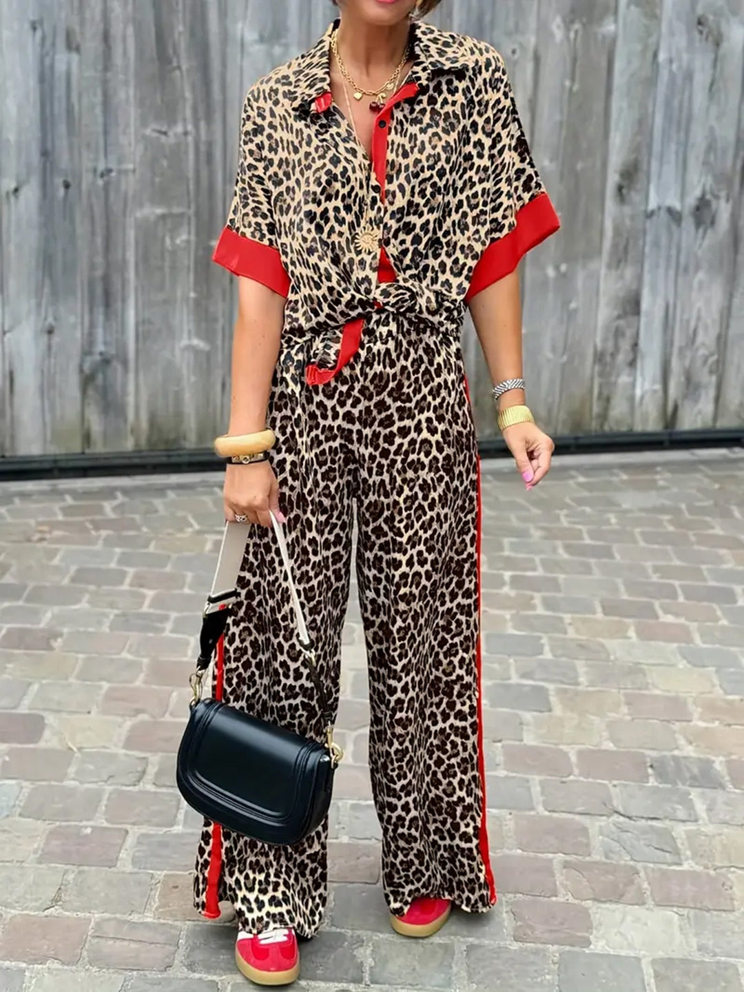 Women's chic leopard print wide leg V-neck jumpsuit. Perfect for versatile summer & spring fashion.
