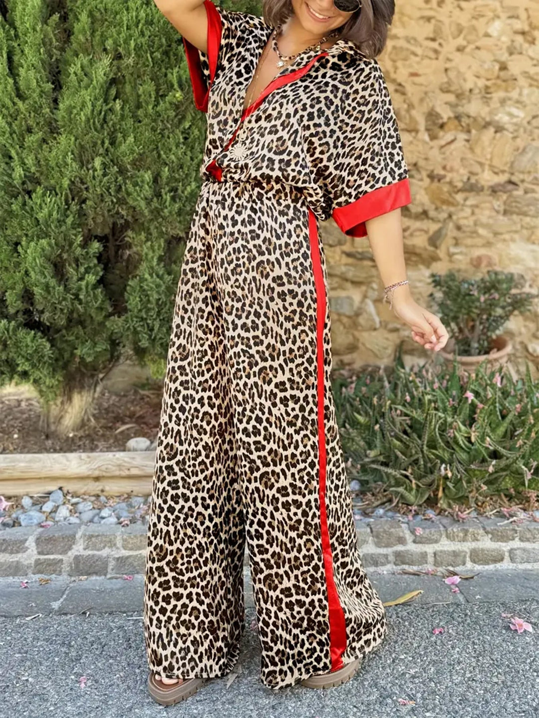 Relaxed fit women's leopard print V-neck jumpsuit with stylish wide leg design.