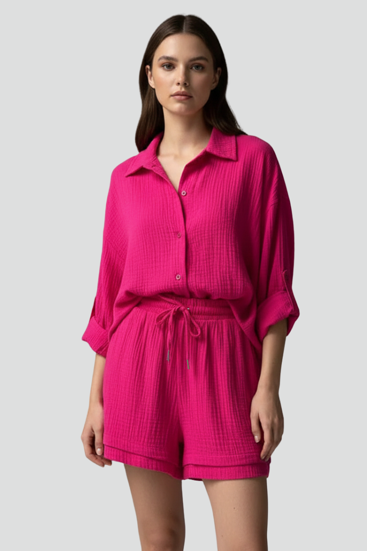 Lightweight women's lounge set: airy button-up shirt & drawstring shorts. Perfect for warm weather chic relaxation.