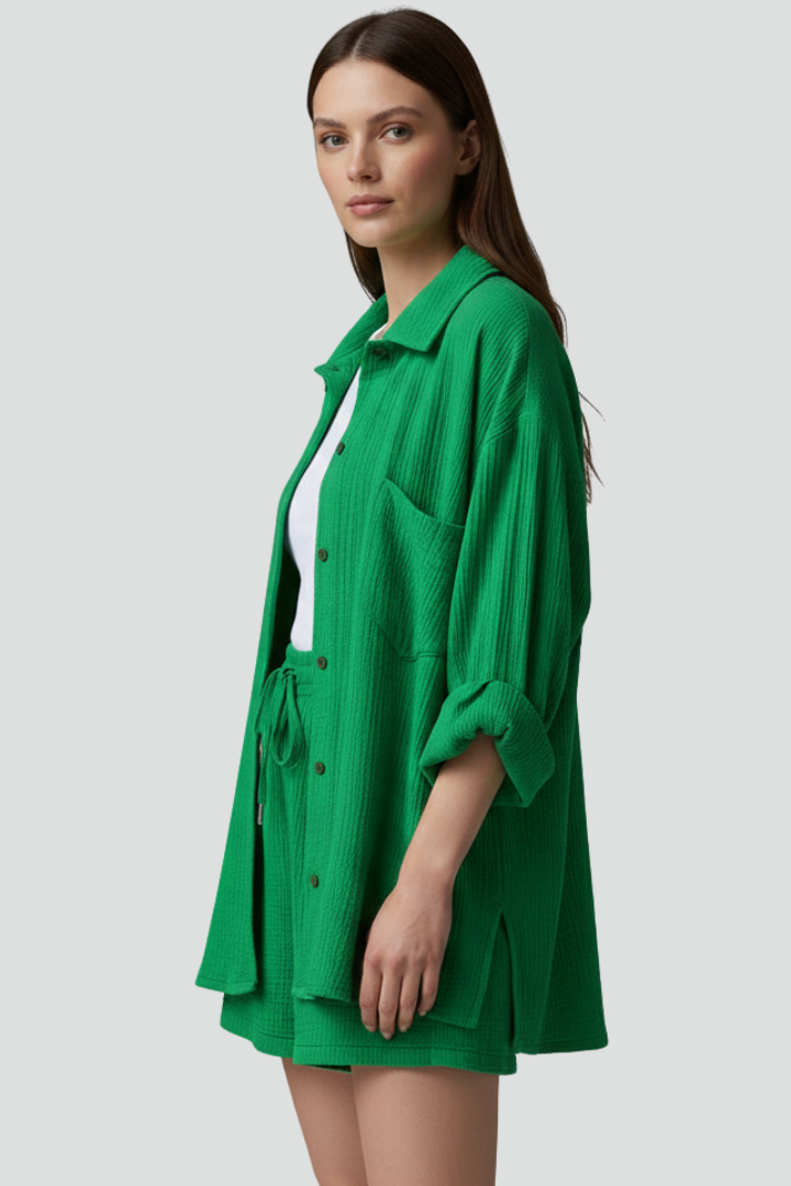 Stylish women's matching lounge set with a relaxed fit button-up top and comfy drawstring shorts for casual wear.