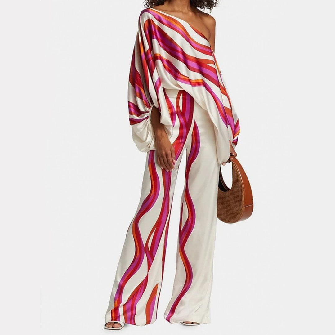 Elegant off-shoulder top and shorts two-piece set with flowy lantern sleeves for women's summer style.