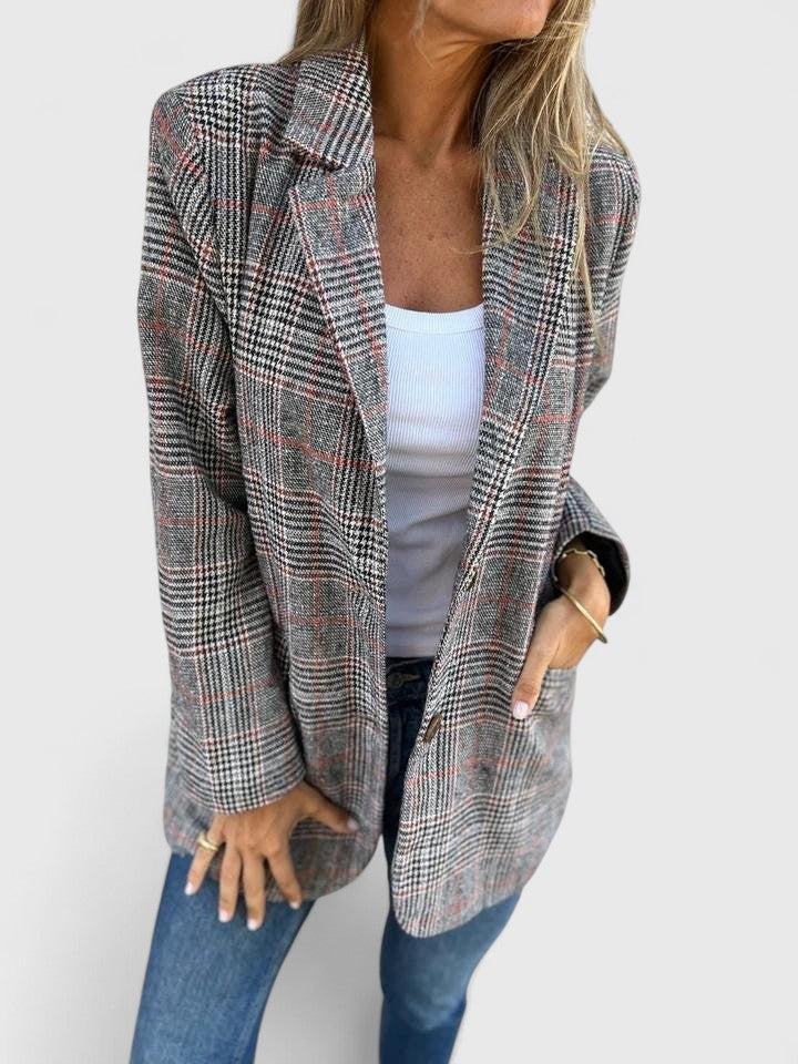 Chic women's plaid boyfriend blazer with a relaxed fit, ideal for modern women's fashion outerwear.